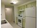 Bright kitchen features white appliances and light wood cabinets at 253 Holly Rd, Venice, FL 34293