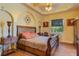 Spacious bedroom with large bed, wood furniture and window at 25606 Aysen Dr, Punta Gorda, FL 33983