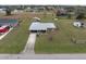 Aerial view of a single-story house with driveway at 30087 Alder Rd, Punta Gorda, FL 33982