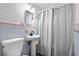 Clean bathroom with pastel tile and a shower/tub combo at 30087 Alder Rd, Punta Gorda, FL 33982