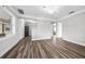 Living room featuring wood-look floors and neutral wall colors at 30087 Alder Rd, Punta Gorda, FL 33982