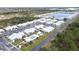 Aerial view of community, pool, and lake at 3300 Loveland Blvd # 3303, Punta Gorda, FL 33980