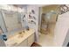 Clean bathroom with a walk-in shower and updated vanity at 3300 Loveland Blvd # 3303, Punta Gorda, FL 33980