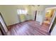Bedroom with wood flooring and access to a bathroom at 3300 Loveland Blvd # 3303, Punta Gorda, FL 33980