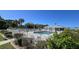 Inviting community pool with lounge chairs and a shaded area at 3300 Loveland Blvd # 3303, Punta Gorda, FL 33980