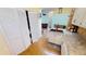 Bright kitchen with white cabinets and laundry closet at 3300 Loveland Blvd # 3303, Punta Gorda, FL 33980