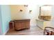 Wet bar with granite countertop and bamboo cabinetry at 3300 Loveland Blvd # 3303, Punta Gorda, FL 33980