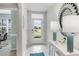 Bright and airy foyer with tile floors and modern light fixtures at 3340 Jennings Blvd, Port Charlotte, FL 33981