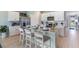 Island kitchen with white cabinets and quartz countertops at 3340 Jennings Blvd, Port Charlotte, FL 33981