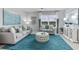 Relaxing living room with teal rug and comfortable seating at 3340 Jennings Blvd, Port Charlotte, FL 33981