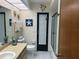Clean bathroom with a tub shower combo and updated vanity at 3761 Peace River Dr, Punta Gorda, FL 33983