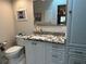 Modern bathroom with granite countertops and a walk-in shower at 3761 Peace River Dr, Punta Gorda, FL 33983