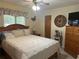 Bright bedroom with a double bed and wood dresser at 3761 Peace River Dr, Punta Gorda, FL 33983