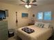 Guest bedroom with a queen-size bed and dresser at 3761 Peace River Dr, Punta Gorda, FL 33983