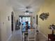 Dining room with table for eight and view of the pool area at 3761 Peace River Dr, Punta Gorda, FL 33983