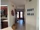 Bright hallway with access to the kitchen and front entrance at 3761 Peace River Dr, Punta Gorda, FL 33983