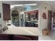 Modern kitchen with dark wood cabinets, granite countertops, and stainless steel appliances at 3761 Peace River Dr, Punta Gorda, FL 33983