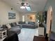 Spacious living room with a large sectional sofa and skylight at 3761 Peace River Dr, Punta Gorda, FL 33983