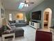Large living room with sectional sofa and flat-screen TV at 3761 Peace River Dr, Punta Gorda, FL 33983