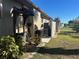 Landscaped side yard with AC unit at 3761 Peace River Dr, Punta Gorda, FL 33983