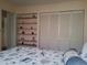 Bedroom with built-in shelves and large closet at 3830 Bal Harbor Blvd # 17, Punta Gorda, FL 33950
