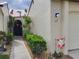 Front entrance with walkway and landscaping at 3830 Bal Harbor Blvd # 17, Punta Gorda, FL 33950