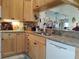 Kitchen with granite countertop and white appliances at 3830 Bal Harbor Blvd # 17, Punta Gorda, FL 33950