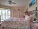 Main bedroom with king-size bed and water views at 3830 Bal Harbor Blvd # 17, Punta Gorda, FL 33950