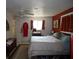 Bedroom with double bed, red walls, and ceiling fan at 4363 Sansedro St, Port Charlotte, FL 33948