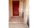 Front entry with red door and tiled floor at 4363 Sansedro St, Port Charlotte, FL 33948