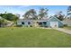 Newly renovated light blue house with a well-maintained lawn and driveway at 4372 Tollefson Ave, North Port, FL 34287