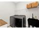 Laundry room featuring a utility sink and modern appliances at 454 Ibiza Loop, Venice, FL 34292