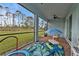 Enjoy this screened porch with a view of the backyard and playground at 454 Ibiza Loop, Venice, FL 34292