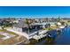 Beautiful home features a private pool, dock, and lush landscaping at 4600 Almar Dr, Punta Gorda, FL 33950