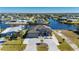 Aerial view of waterfront home with paver driveway and canal access at 4600 Almar Dr, Punta Gorda, FL 33950