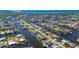 Aerial view of house on canal with lush landscaping at 4600 Almar Dr, Punta Gorda, FL 33950