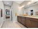Elegant bathroom with double vanity and view of bedroom at 4600 Almar Dr, Punta Gorda, FL 33950