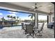 Covered patio with seating area, overlooking pool and canal at 4600 Almar Dr, Punta Gorda, FL 33950