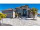Single-story home with gray exterior, tile roof, and paver driveway at 4600 Almar Dr, Punta Gorda, FL 33950