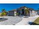 Single-story home with tile roof, driveway and landscaping at 4600 Almar Dr, Punta Gorda, FL 33950