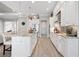 Modern kitchen featuring white cabinetry, granite countertops, and a breakfast bar at 4600 Almar Dr, Punta Gorda, FL 33950