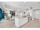 Open kitchen with large island, stainless steel appliances, and views to living room at 4600 Almar Dr, Punta Gorda, FL 33950
