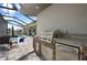 Stainless steel outdoor kitchen with built-in grill at 4600 Almar Dr, Punta Gorda, FL 33950