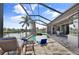 Screened pool and patio area with water view at 4600 Almar Dr, Punta Gorda, FL 33950
