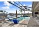 Inviting pool with blue lounge chairs and canal view at 4600 Almar Dr, Punta Gorda, FL 33950