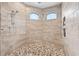 Large walk-in shower with dual shower heads and pebble floor at 4600 Almar Dr, Punta Gorda, FL 33950