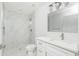 Modern bathroom with marble shower and white vanity at 517 Biscayne Dr, Port Charlotte, FL 33953