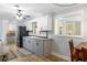 Modern kitchen with gray cabinets and wood flooring at 5273 Grassland Ter, Port Charlotte, FL 33981