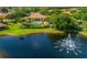 Community pool and clubhouse near lake at 6139 Grand Cypress Blvd, North Port, FL 34287