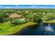 Aerial view of community with pool, lake, fountain at 6139 Grand Cypress Blvd, North Port, FL 34287